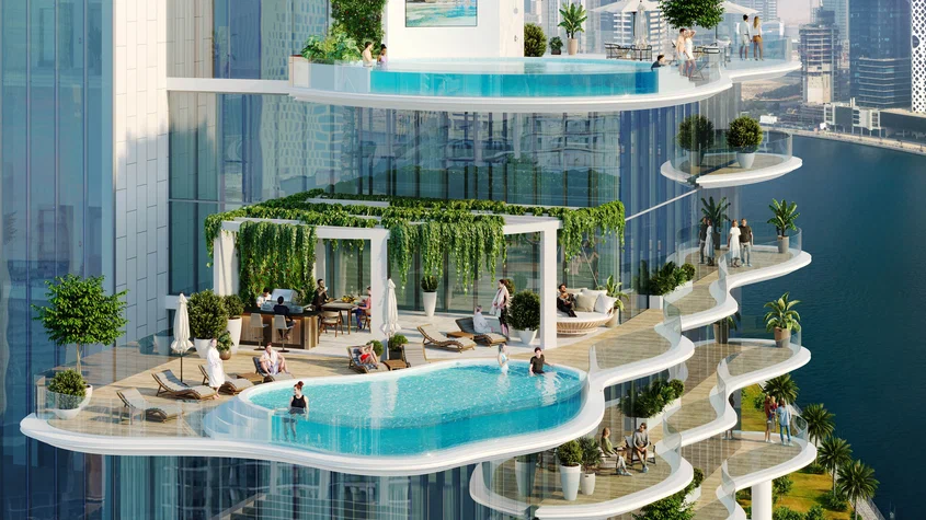 Luxury apartment tower with landscaped balconies at dusk